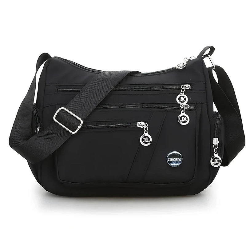 Stylish Multi-Pocket Shoulder Bag for Women, Lightweight and Spacious Design with Zippered Compartments and Fashionable Charm Details