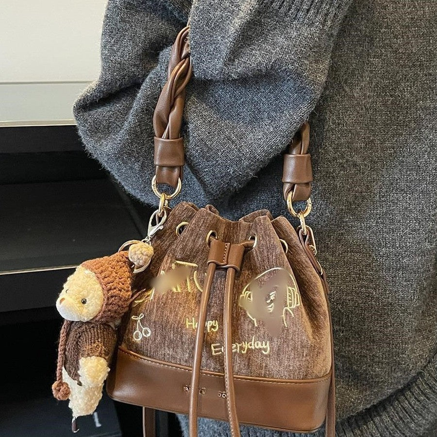 Charming Bucket Bag with Cartoon Bear Charm, Drawstring Closure and Twisted Handle for Everyday Fashion