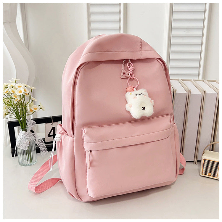 Stylish High-Capacity Backpack for Teen Girls, Japanese Casual Design with Cute Plush Charm and Durable Nylon Material