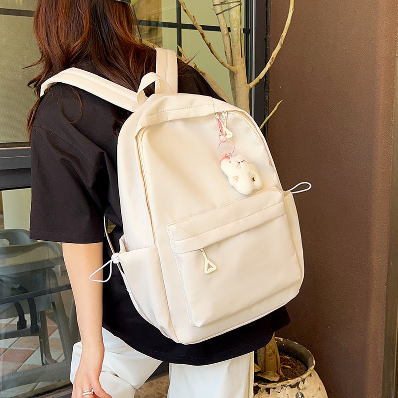 Stylish High-Capacity Backpack for Teen Girls, Japanese Casual Design with Cute Plush Charm and Durable Nylon Material