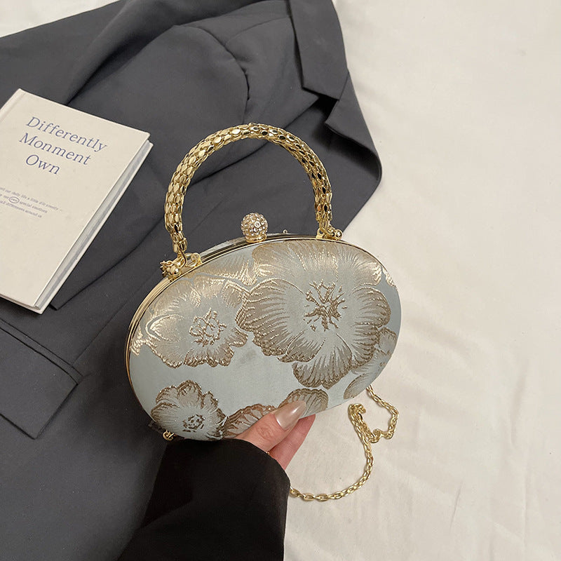 Elegant Embroidered Oval Handbag with Golden Chain Strap for Evening and Daily Use