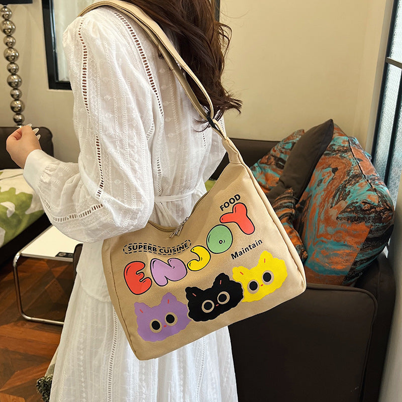 Cute Cartoon Cat Print Canvas Tote Bag with Colorful 'ENJOY' Lettering and Zipper Closure for Daily Use