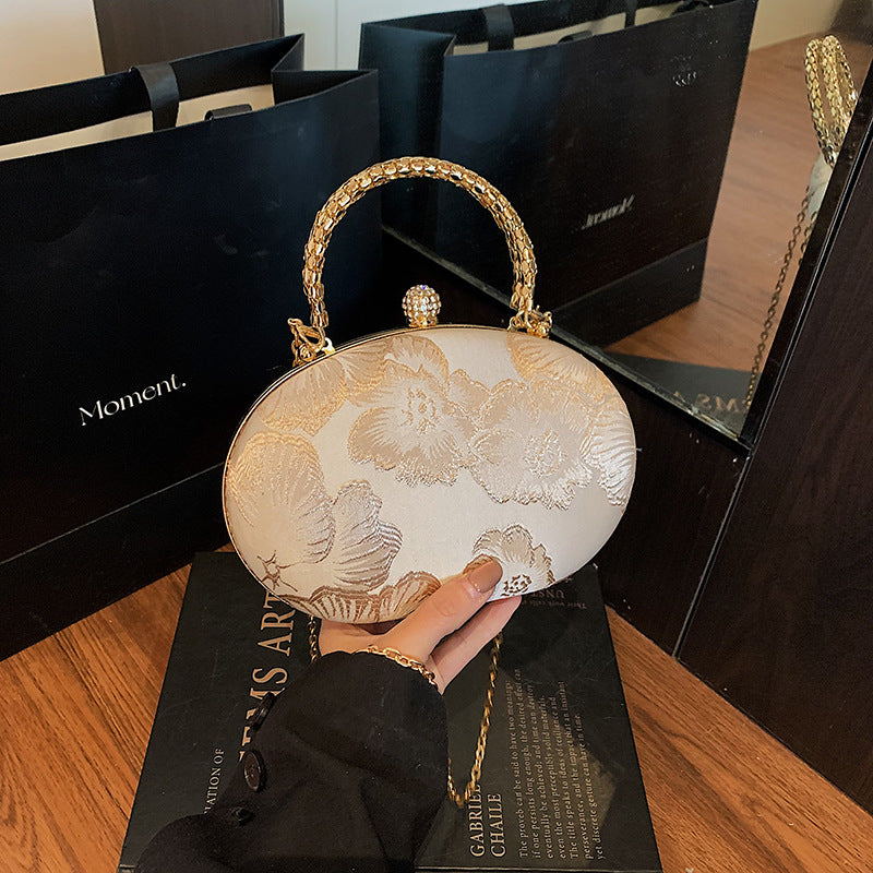 Elegant Embroidered Oval Handbag with Golden Chain Strap for Evening and Daily Use