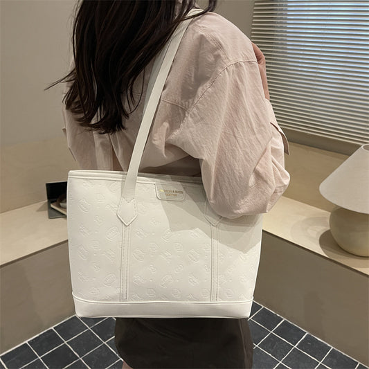 Chic Embossed Tote Bag for Women with Fashionable Monogram Pattern and Spacious Design Perfect for Daily Commute and Casual Outings
