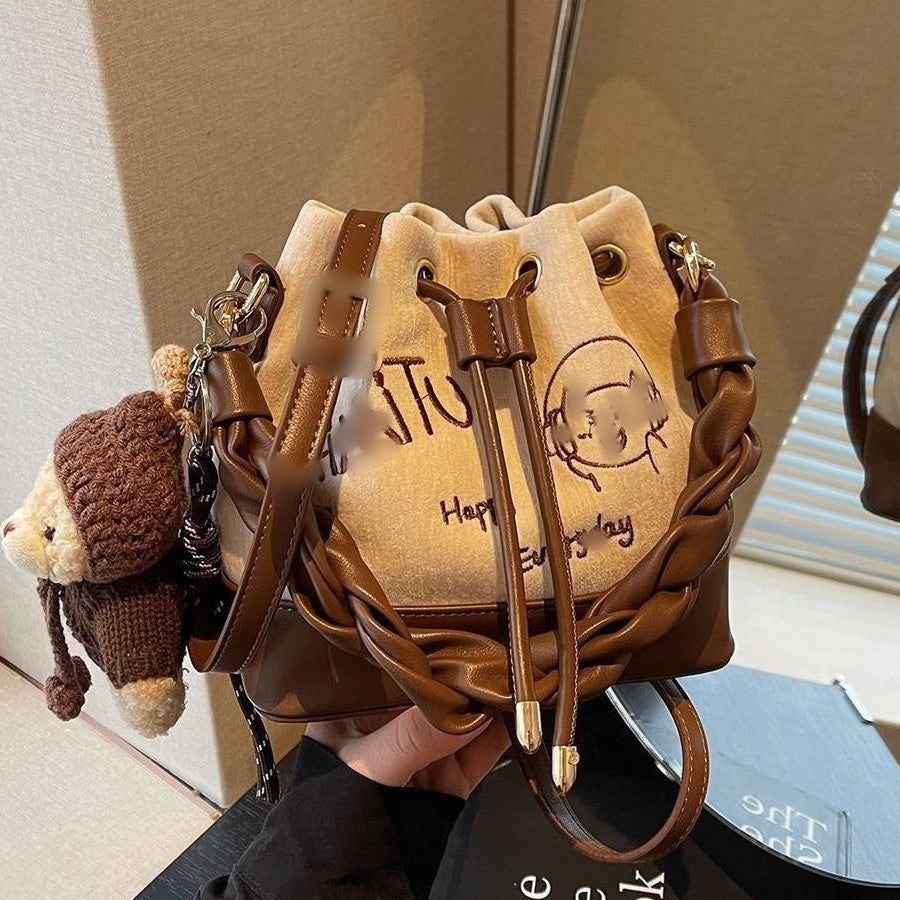Charming Bucket Bag with Cartoon Bear Charm, Drawstring Closure and Twisted Handle for Everyday Fashion