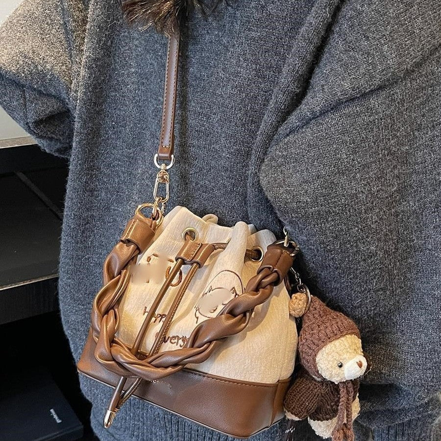 Charming Bucket Bag with Cartoon Bear Charm, Drawstring Closure and Twisted Handle for Everyday Fashion
