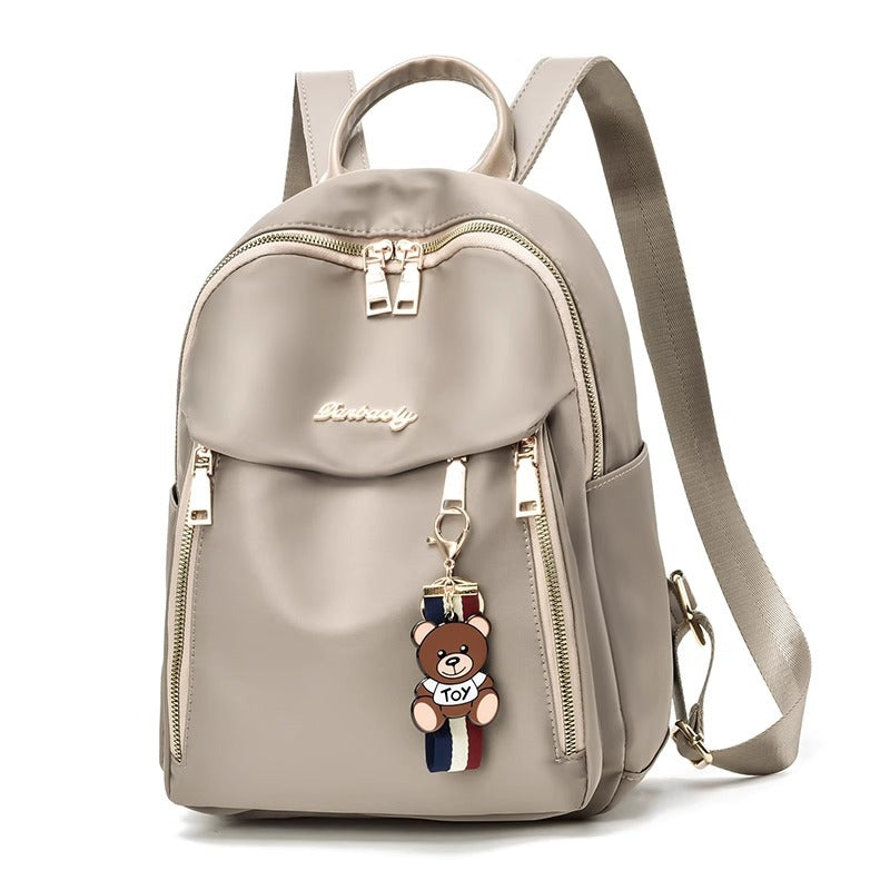 Fashionable Oxford Fabric Backpack for Women with Bear Charm, Waterproof and Durable Design for Daily Use and Travel