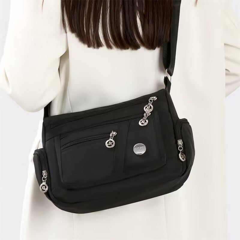 Stylish Multi-Pocket Shoulder Bag for Women, Lightweight and Spacious Design with Zippered Compartments and Fashionable Charm Details