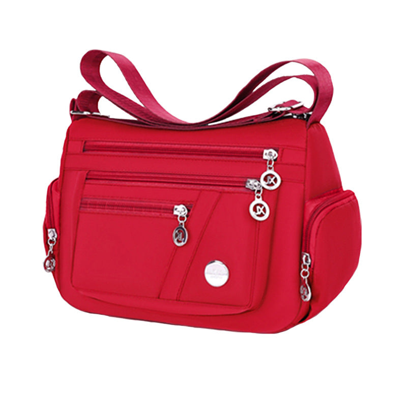 Stylish Multi-Pocket Shoulder Bag for Women, Lightweight and Spacious Design with Zippered Compartments and Fashionable Charm Details