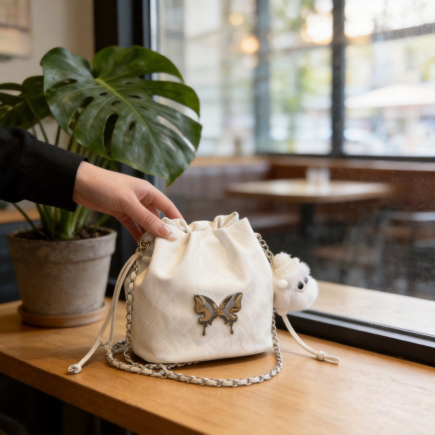 Fashionable Drawstring Bucket Bag with Chain Strap and Cute Pom-Pom Charm for Women