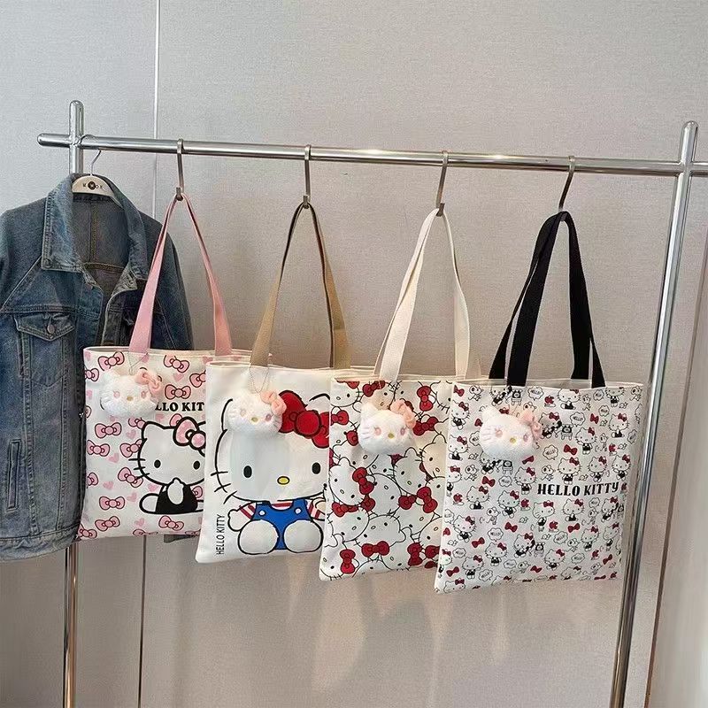 Hello Kitty Canvas Tote Bag with Cute Plush Charm, Large Capacity Shoulder Bag for Women, Perfect for Daily Use and Travel