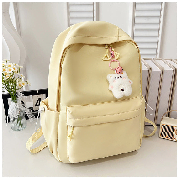 Stylish High-Capacity Backpack for Teen Girls, Japanese Casual Design with Cute Plush Charm and Durable Nylon Material