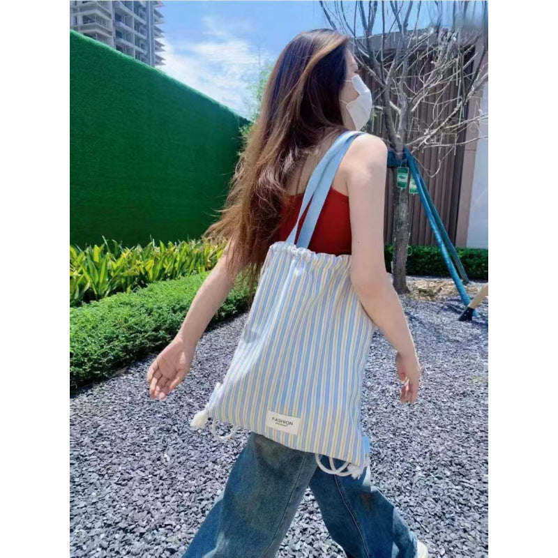 Canvas casual backpack for women, new drawstring striped large capacity shoulder bag