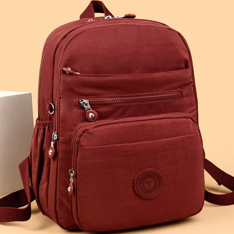 Lightweight Breathable Nylon Backpack for Travel and School, Fashionable Street Style with Multiple Pockets and Zipper Closure