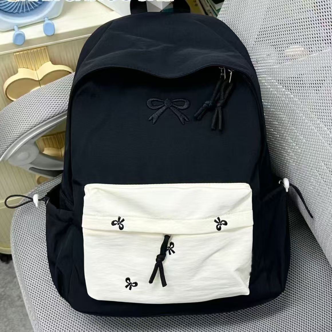 Cute Bow Embroidery Backpack for Students and Travel - Waterproof, Large Capacity, Lightweight Design with Stylish Front Pocket