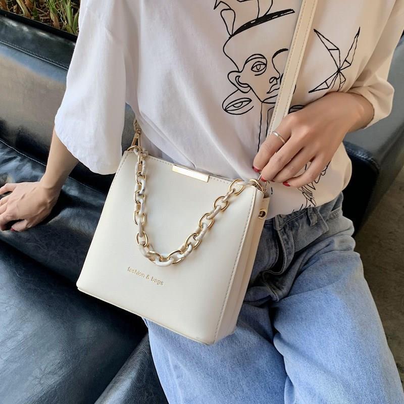 Chic Urban Mini Bucket Bag with Chain Strap and Zip Closure for Everyday Style