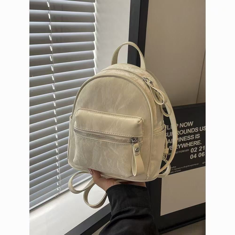 Minimalist PU Backpack for Women - Stylish Daily Commute and Travel Bag with Zippered Pockets and Soft Design