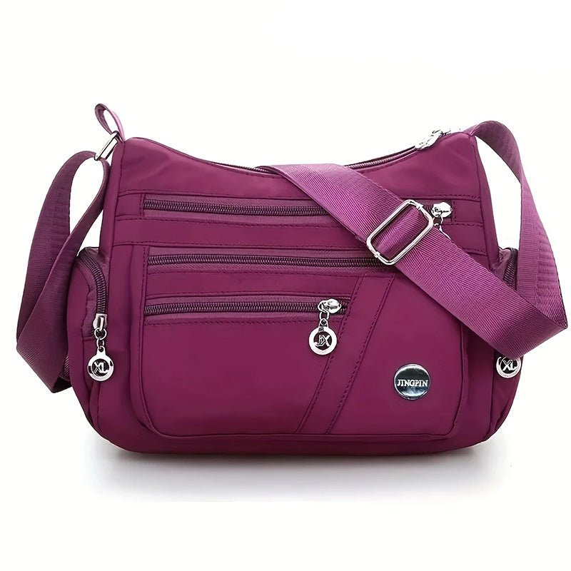 Stylish Multi-Pocket Shoulder Bag for Women, Lightweight and Spacious Design with Zippered Compartments and Fashionable Charm Details