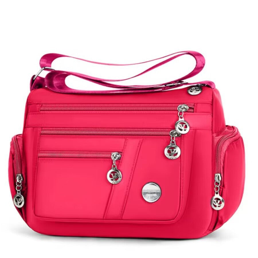 Stylish Multi-Pocket Shoulder Bag for Women, Lightweight and Spacious Design with Zippered Compartments and Fashionable Charm Details