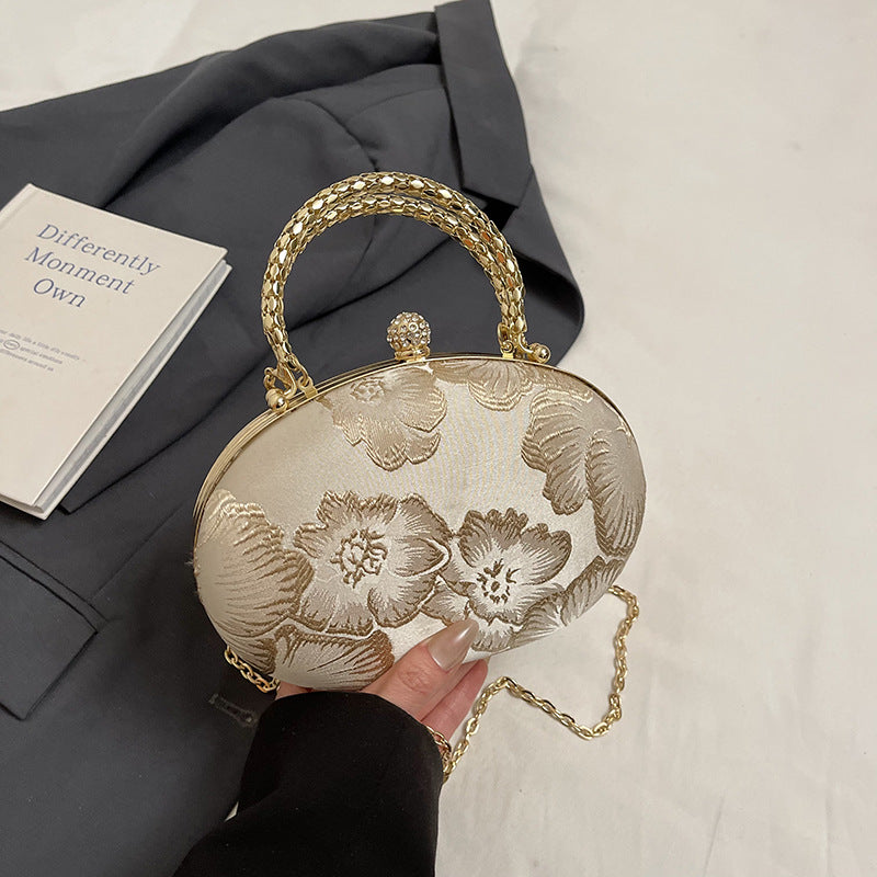 Elegant Embroidered Oval Handbag with Golden Chain Strap for Evening and Daily Use