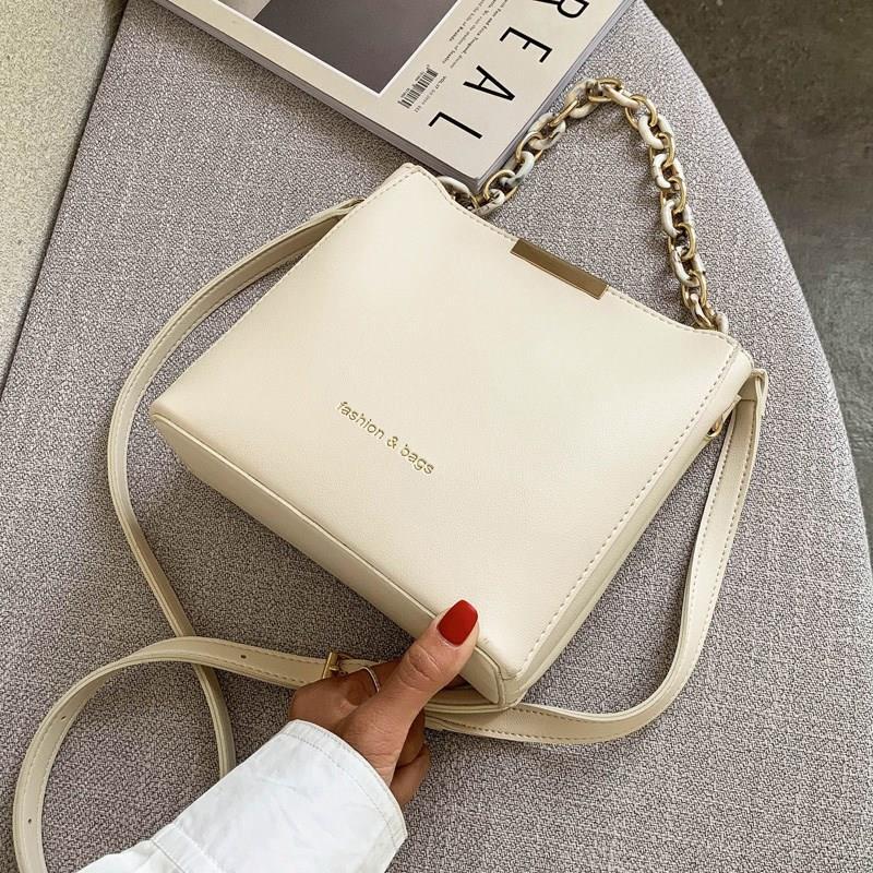 Chic Urban Mini Bucket Bag with Chain Strap and Zip Closure for Everyday Style
