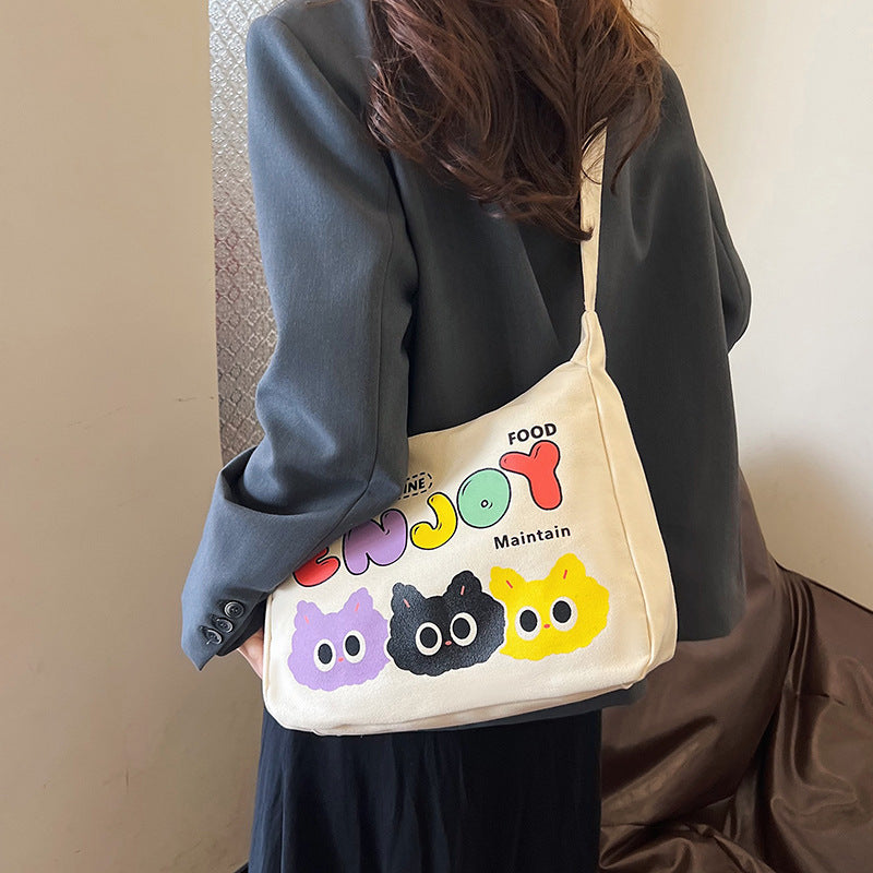 Cute Cartoon Cat Print Canvas Tote Bag with Colorful 'ENJOY' Lettering and Zipper Closure for Daily Use