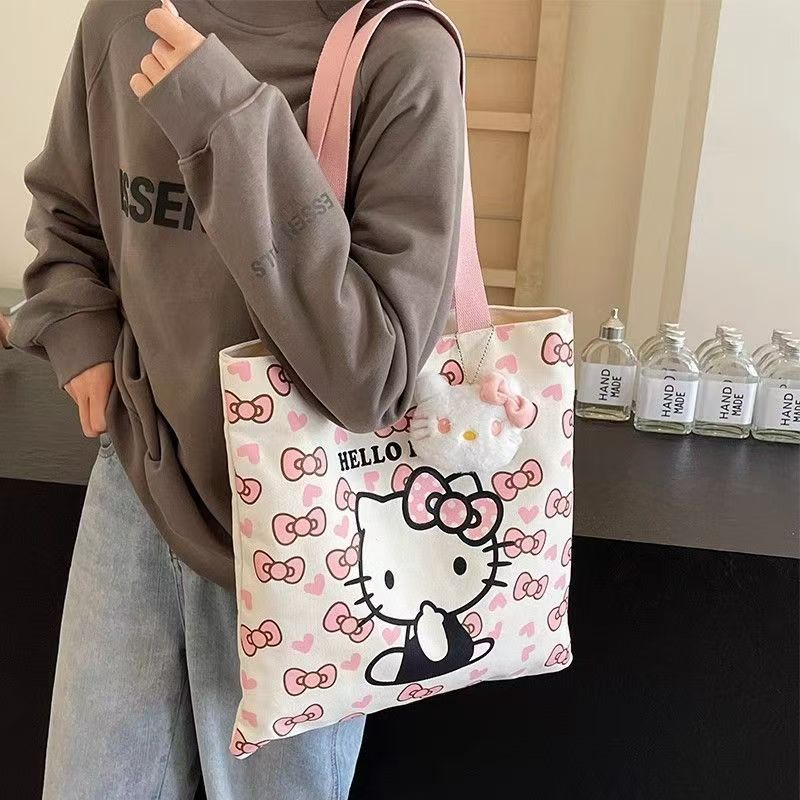 Hello Kitty Canvas Tote Bag with Cute Plush Charm, Large Capacity Shoulder Bag for Women, Perfect for Daily Use and Travel