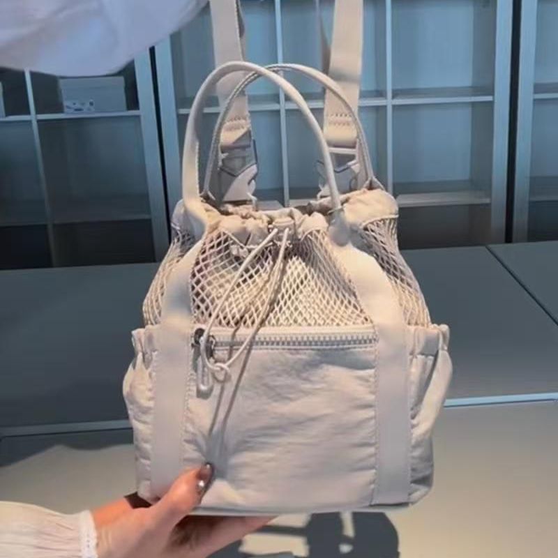 Chic Mesh Drawstring Tote Backpack for Women - Breathable Casual Style with Zippered Pocket and Adjustable Straps