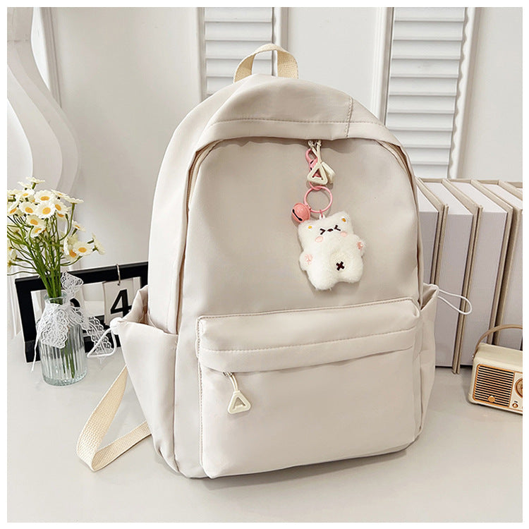Stylish High-Capacity Backpack for Teen Girls, Japanese Casual Design with Cute Plush Charm and Durable Nylon Material