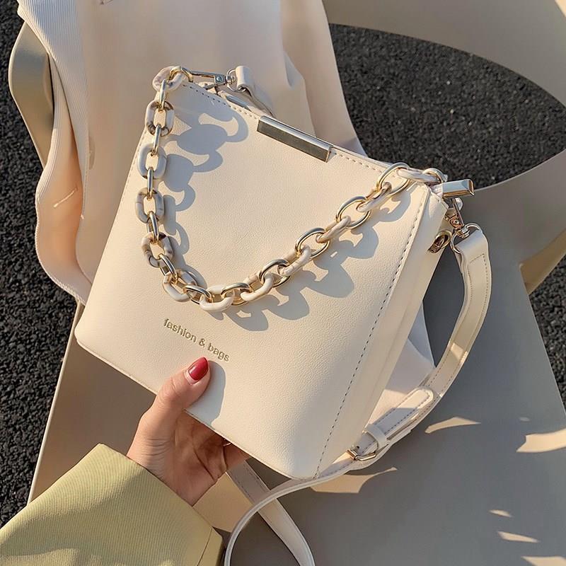 Chic Urban Mini Bucket Bag with Chain Strap and Zip Closure for Everyday Style