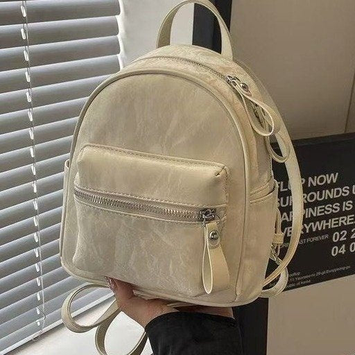 Minimalist PU Backpack for Women - Stylish Daily Commute and Travel Bag with Zippered Pockets and Soft Design