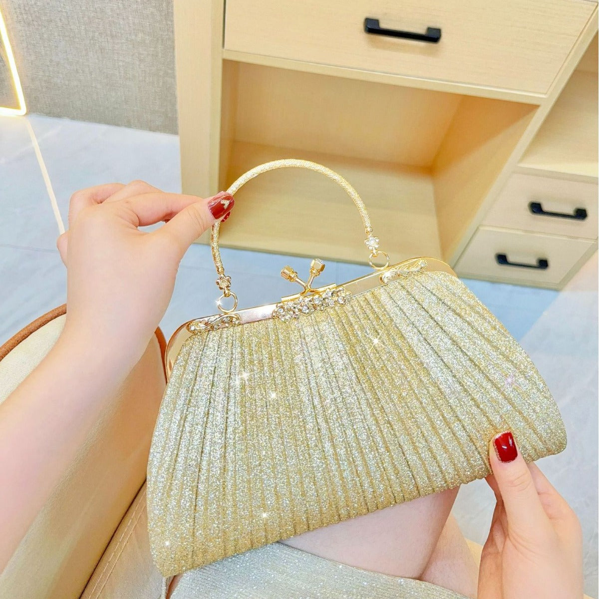 Elegant Pleated Clutch Bag with Rhinestone Closure and Gold Handle for Evening Events