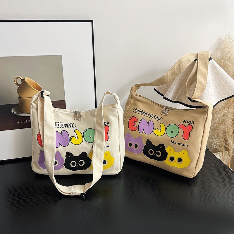Cute Cartoon Cat Print Canvas Tote Bag with Colorful 'ENJOY' Lettering and Zipper Closure for Daily Use
