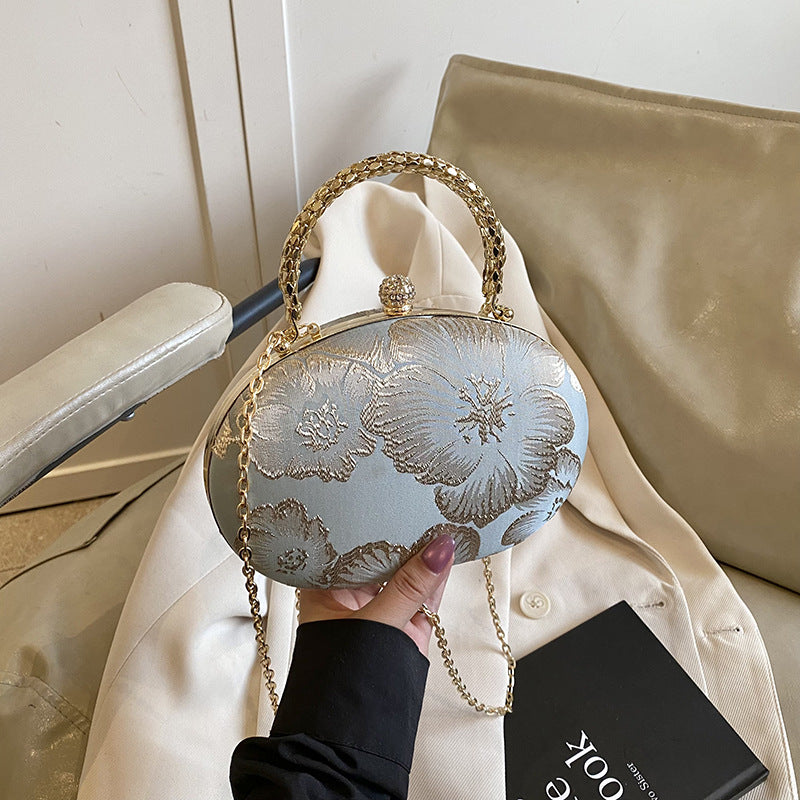 Elegant Embroidered Oval Handbag with Golden Chain Strap for Evening and Daily Use
