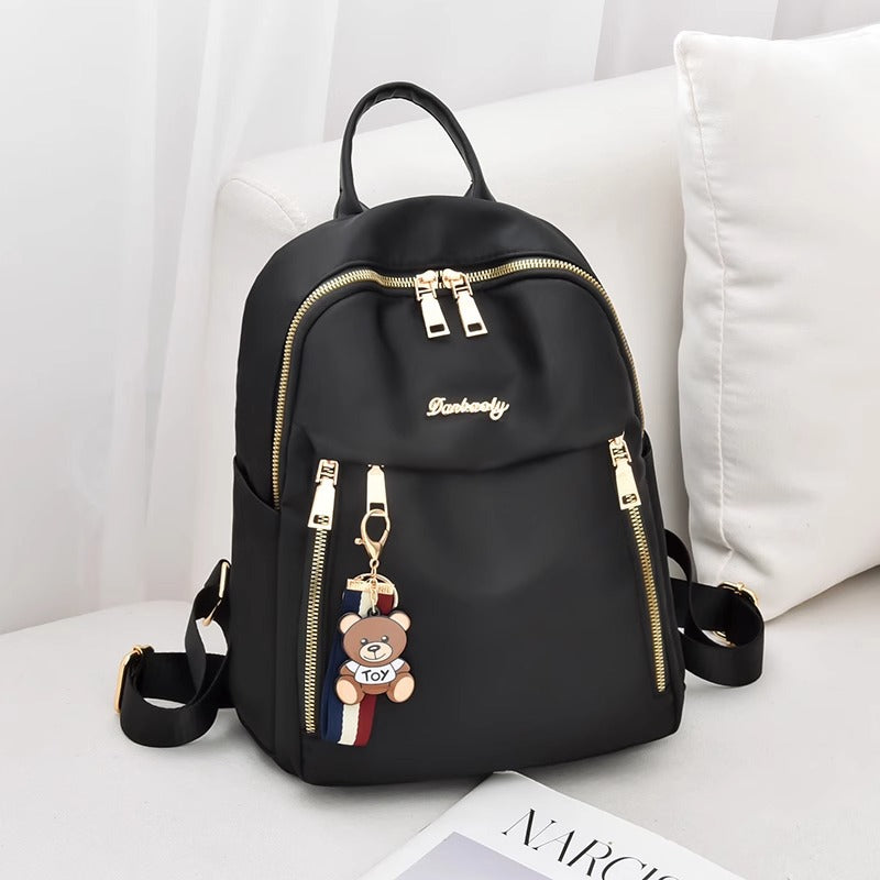 Fashionable Oxford Fabric Backpack for Women with Bear Charm, Waterproof and Durable Design for Daily Use and Travel