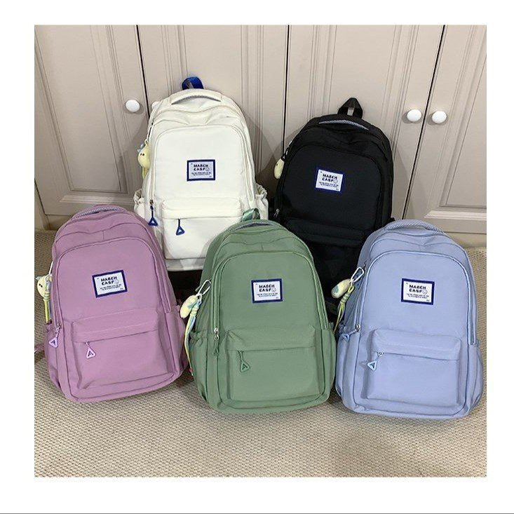 Minimalist High-Capacity Backpack for Students and Daily Use with Fashionable Letter Design