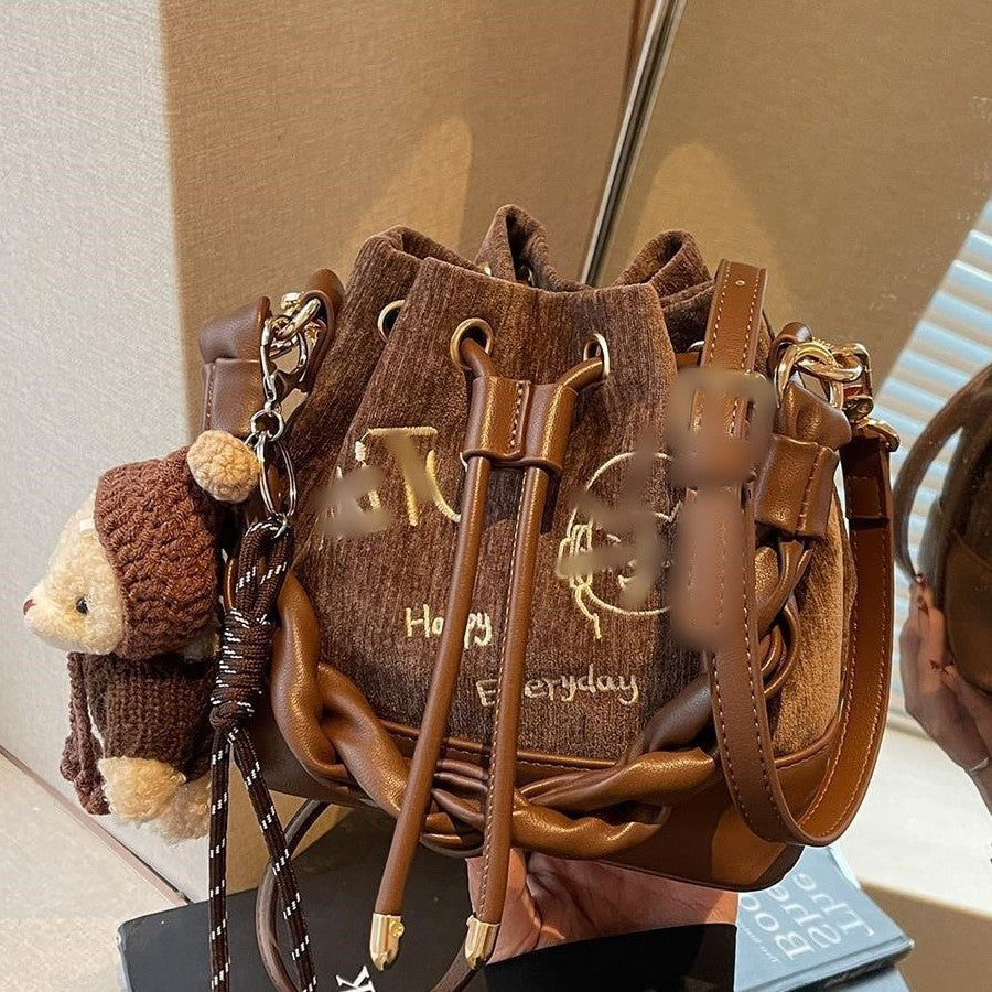 Charming Bucket Bag with Cartoon Bear Charm, Drawstring Closure and Twisted Handle for Everyday Fashion