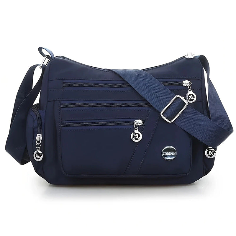 Stylish Multi-Pocket Shoulder Bag for Women, Lightweight and Spacious Design with Zippered Compartments and Fashionable Charm Details