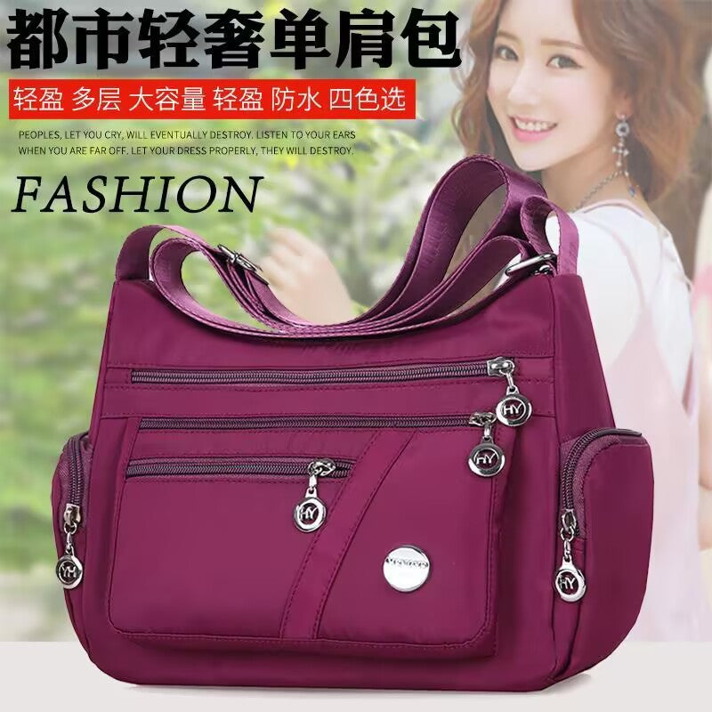 Stylish Multi-Pocket Shoulder Bag for Women, Lightweight and Spacious Design with Zippered Compartments and Fashionable Charm Details