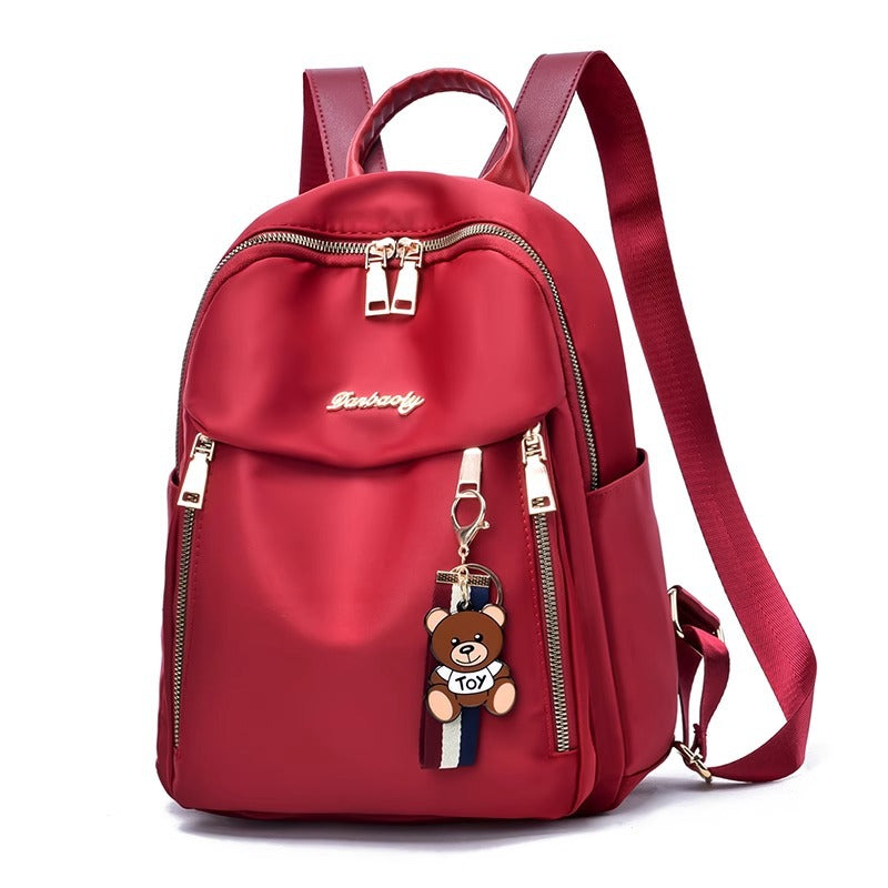 Fashionable Oxford Fabric Backpack for Women with Bear Charm, Waterproof and Durable Design for Daily Use and Travel