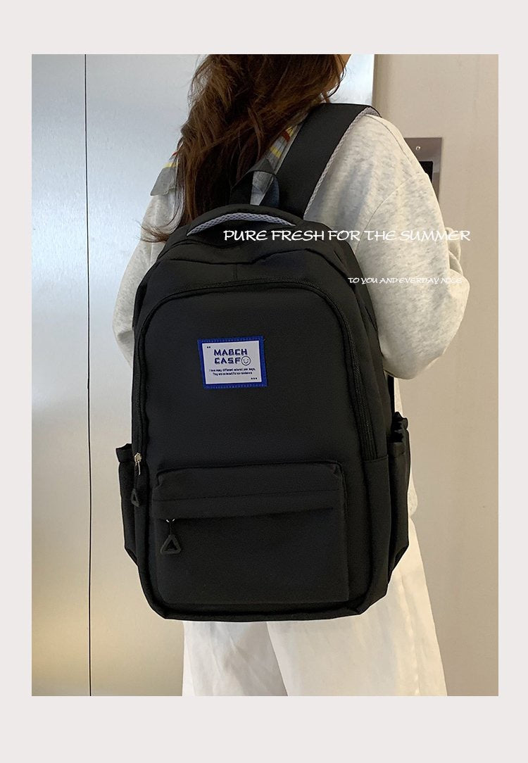 Minimalist High-Capacity Backpack for Students and Daily Use with Fashionable Letter Design