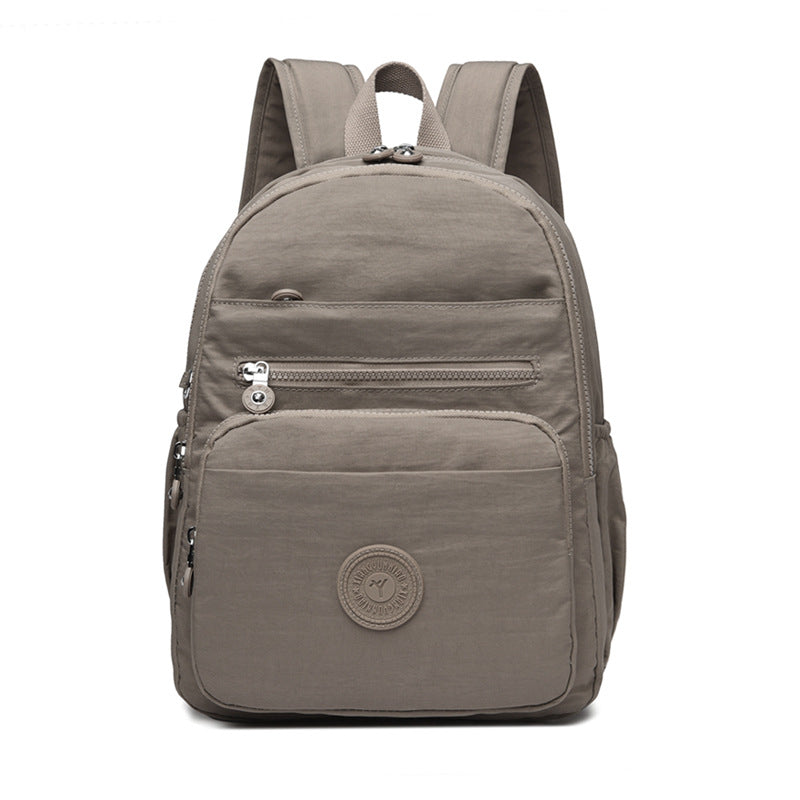Lightweight Breathable Nylon Backpack for Travel and School, Fashionable Street Style with Multiple Pockets and Zipper Closure