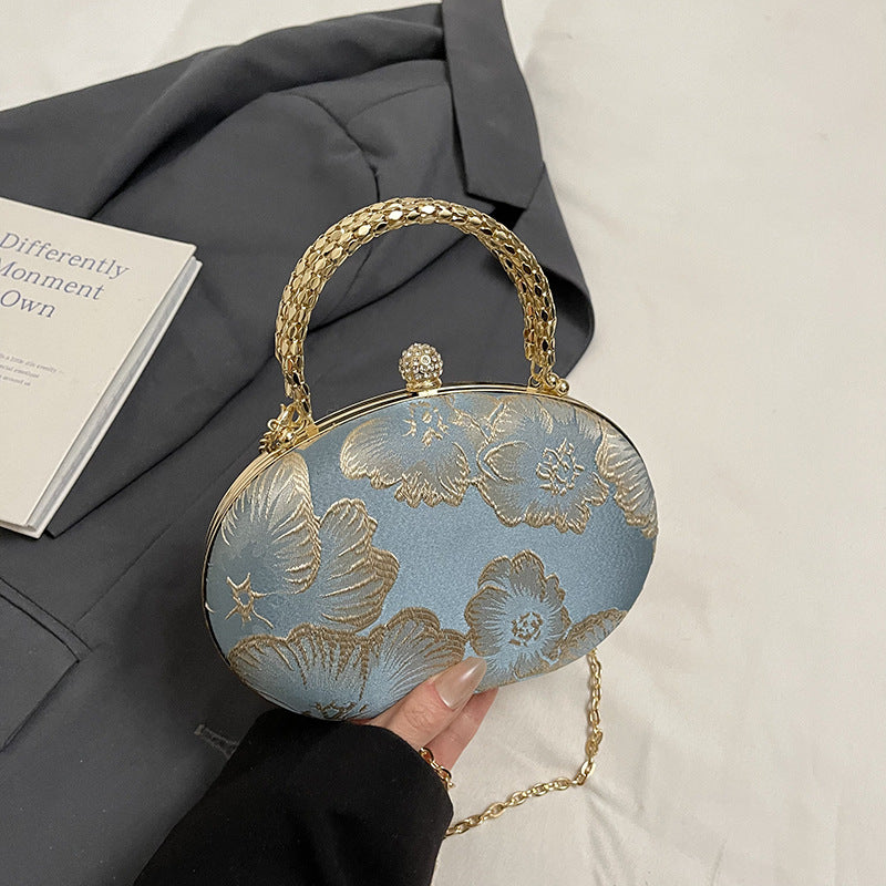 Elegant Embroidered Oval Handbag with Golden Chain Strap for Evening and Daily Use