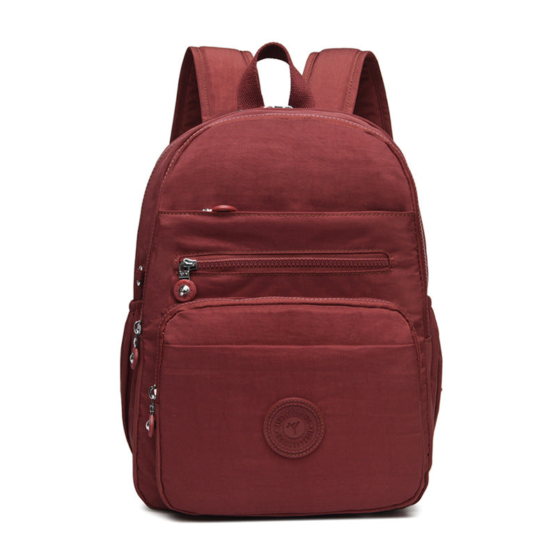 Lightweight Breathable Nylon Backpack for Travel and School, Fashionable Street Style with Multiple Pockets and Zipper Closure