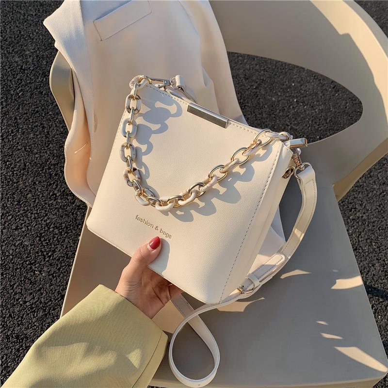 Chic Urban Mini Bucket Bag with Chain Strap and Zip Closure for Everyday Style