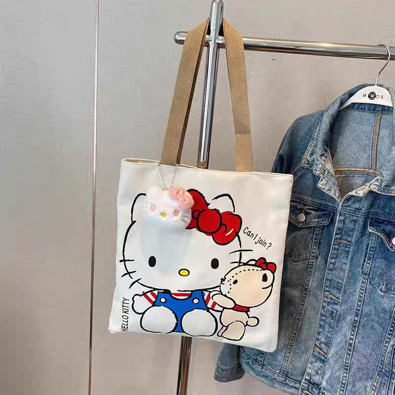 Hello Kitty Canvas Tote Bag with Cute Plush Charm, Large Capacity Shoulder Bag for Women, Perfect for Daily Use and Travel