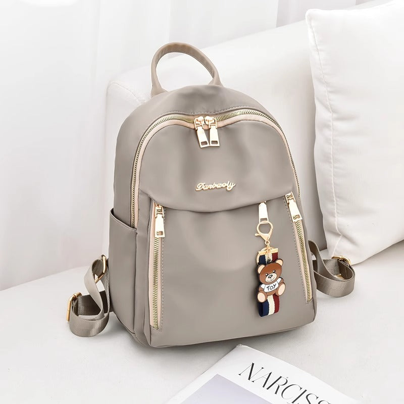 Fashionable Oxford Fabric Backpack for Women with Bear Charm, Waterproof and Durable Design for Daily Use and Travel