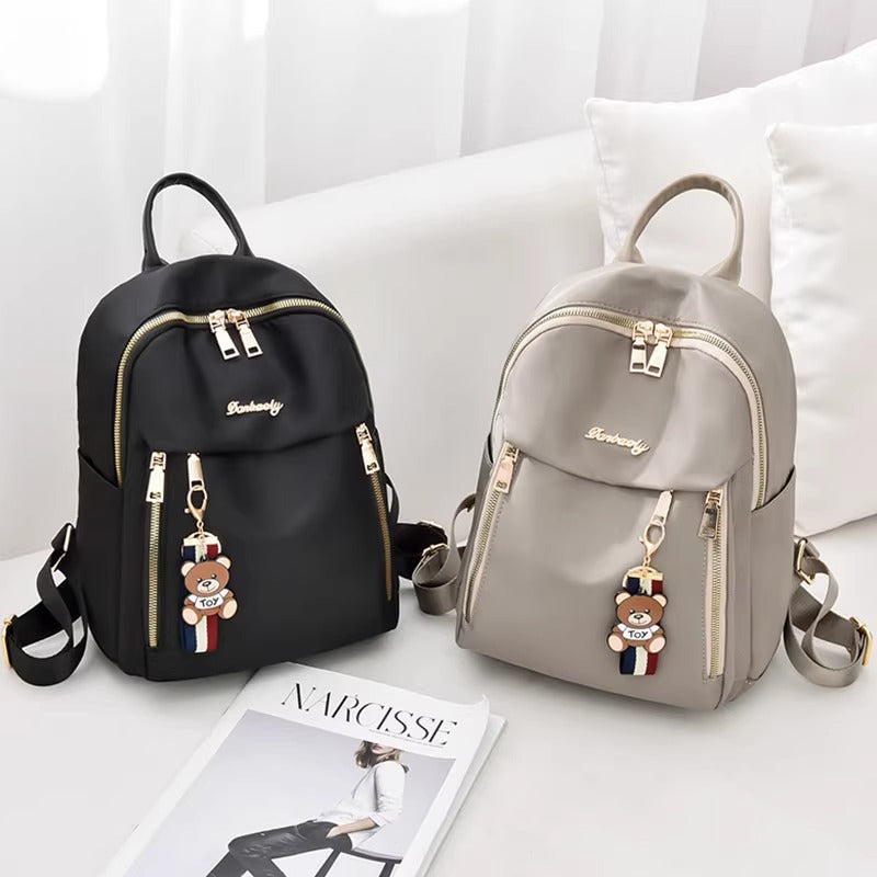 Fashionable Oxford Fabric Backpack for Women with Bear Charm, Waterproof and Durable Design for Daily Use and Travel
