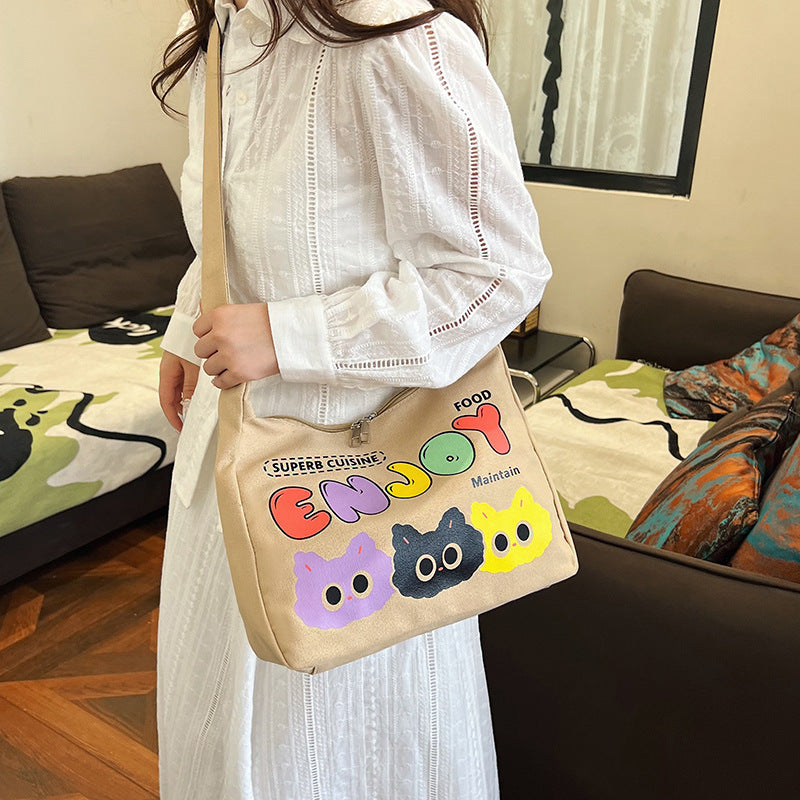 Cute Cartoon Cat Print Canvas Tote Bag with Colorful 'ENJOY' Lettering and Zipper Closure for Daily Use