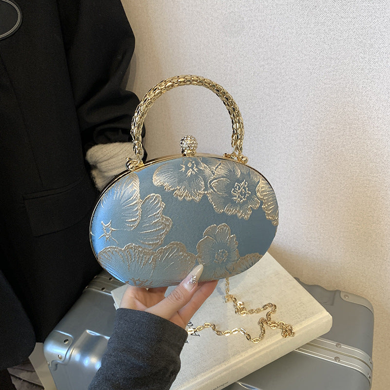 Elegant Embroidered Oval Handbag with Golden Chain Strap for Evening and Daily Use